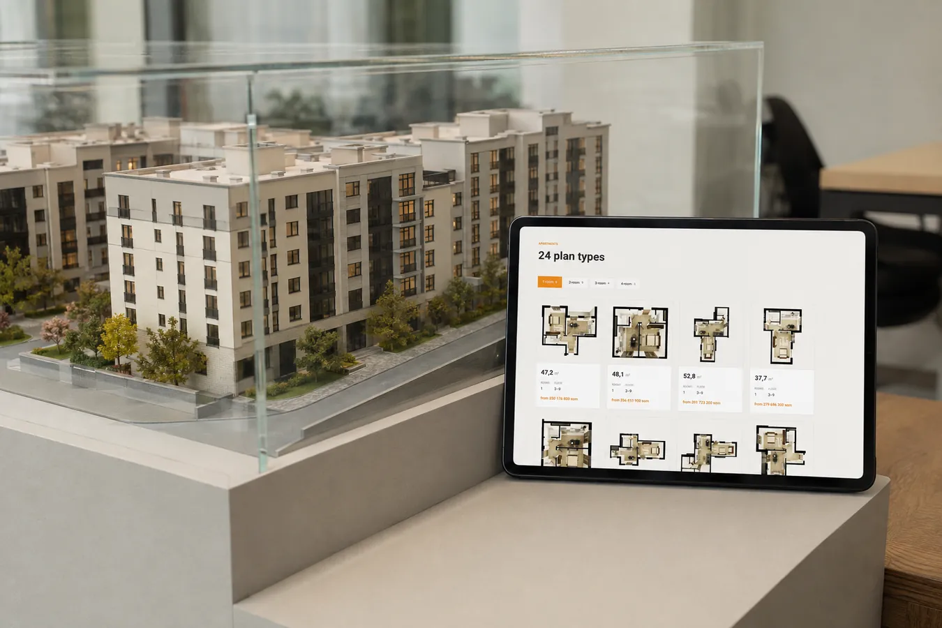 The catalogue beside the sales-office model